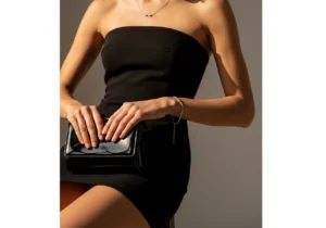 accessories for black strapless mini dress including jewelry and clutch for date night